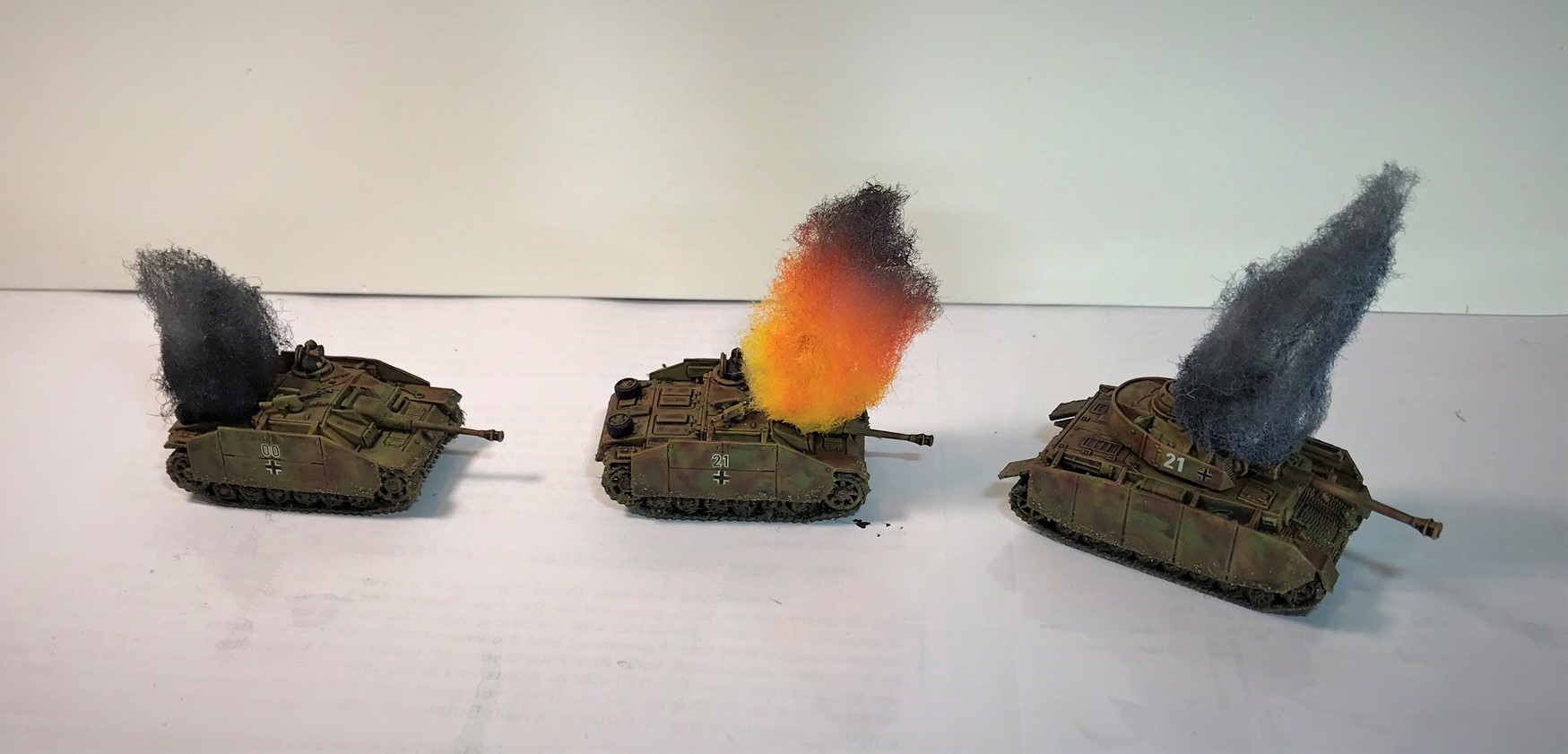 14 StuG G and Panzer IVH with knocked out markers