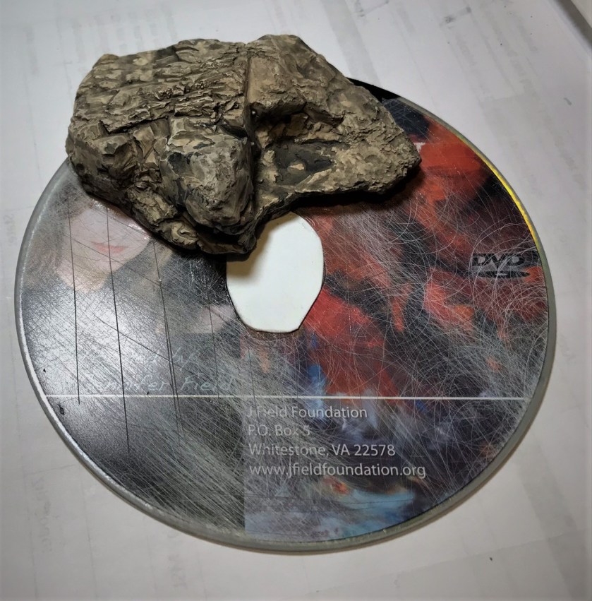 2 cd and stone and card